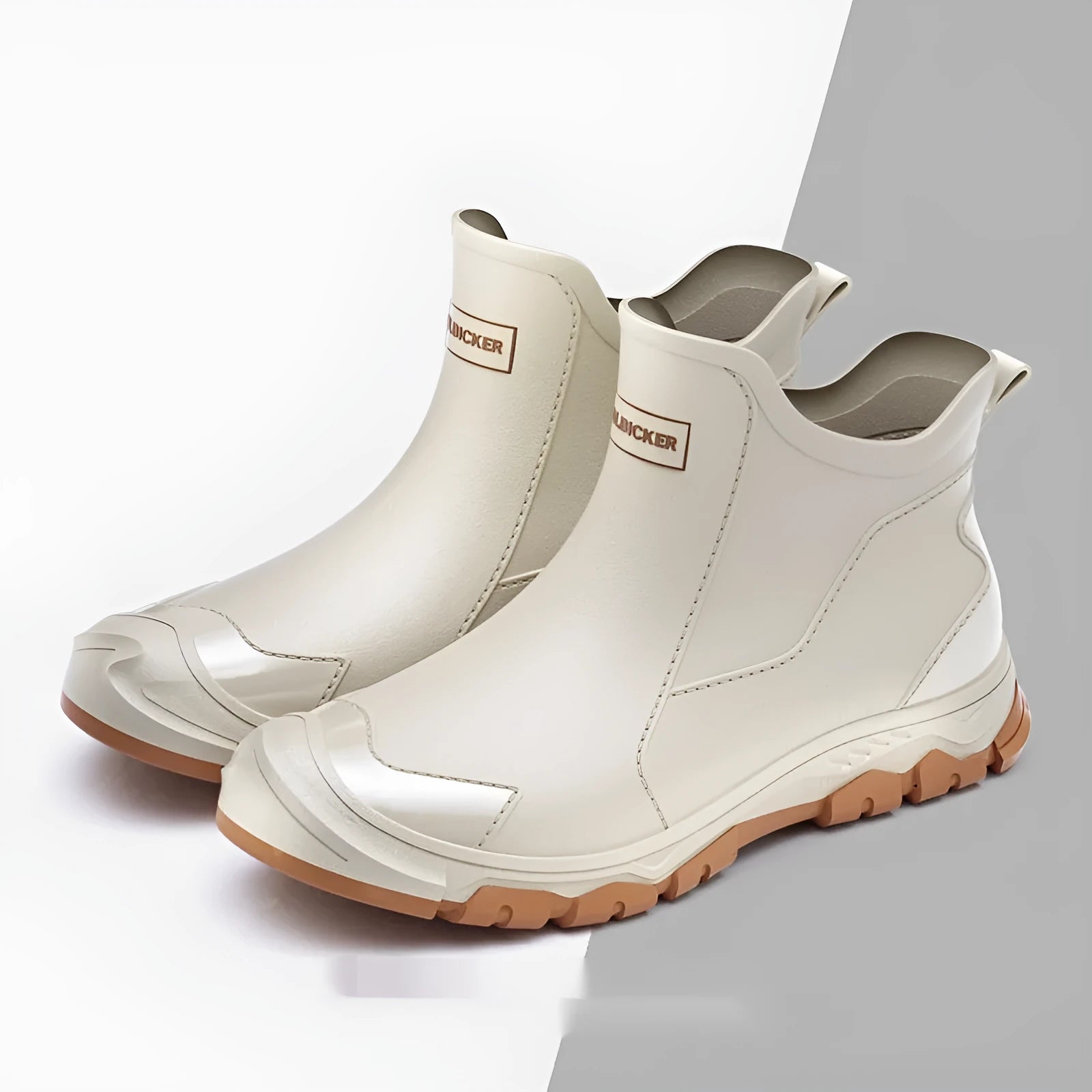 PVC outdoor wading boots in beige and black with red, showing round toe and non-slip plastic sole.