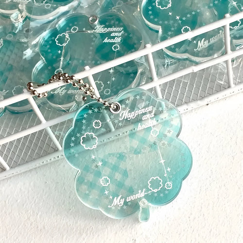Acrylic four-leaf clover keychain pendant in blue, green, or mint colour options.