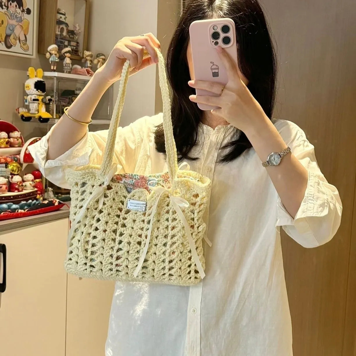 Handwoven wool floral handbag in summer style with natural pattern