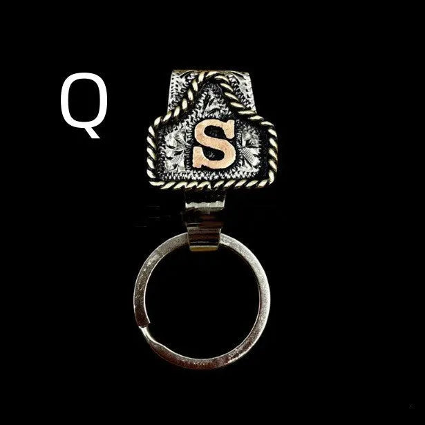 Handmade metal cow tag belt keychain in a selected colour from the A-Z letter range.