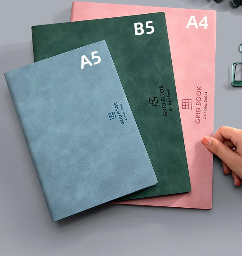 Grid book with hand-painted square grid, PU cover in lake blue, locking plastic binding, A5 size