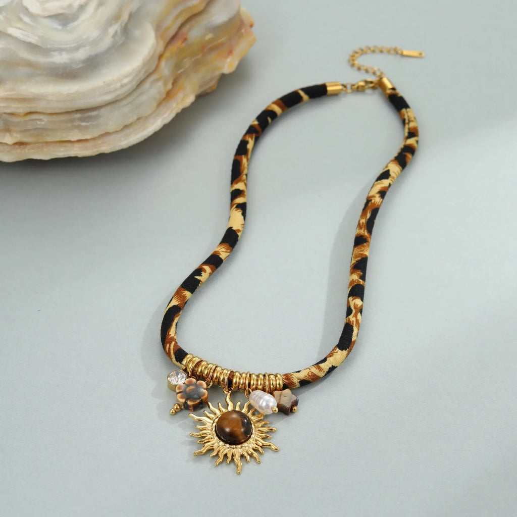Leopard Series geometric stainless steel necklace with gold electroplated finish on a white background.