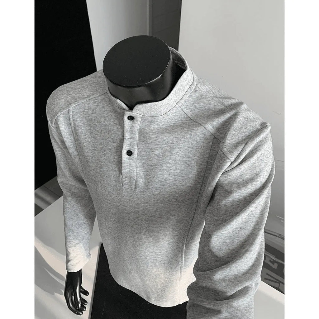 Men's grey asymmetrical stand-up collar cotton polo shirt with patchwork shoulder detail.