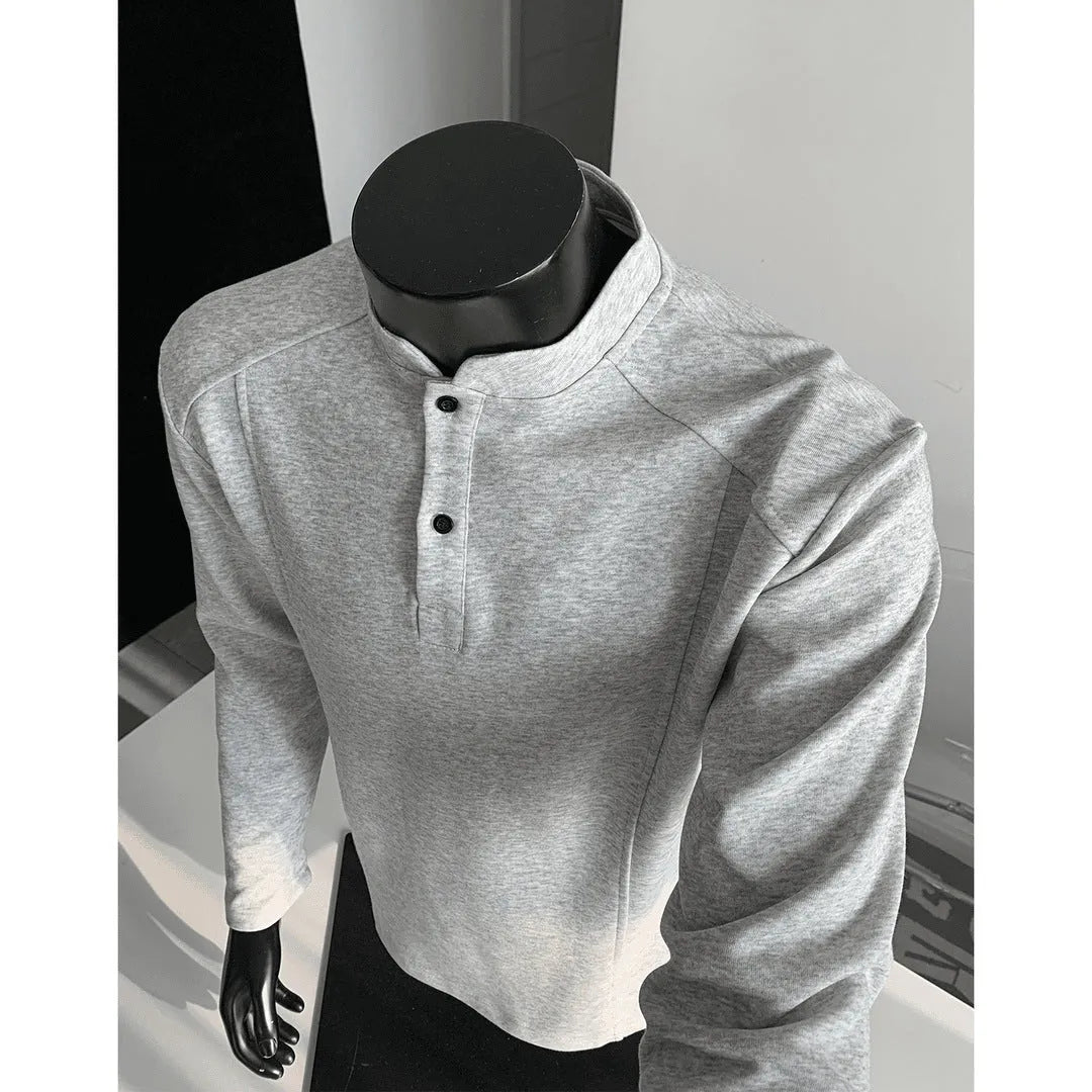 Men's grey asymmetrical stand-up collar cotton polo shirt with patchwork shoulder detail.