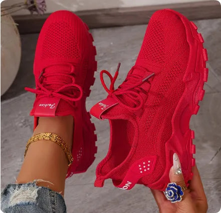 Women's low-top sports shoes with mesh upper and white sole in multiple colours.