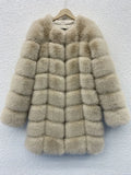 Women's long artificial fur coat in wine red colour on a hanger