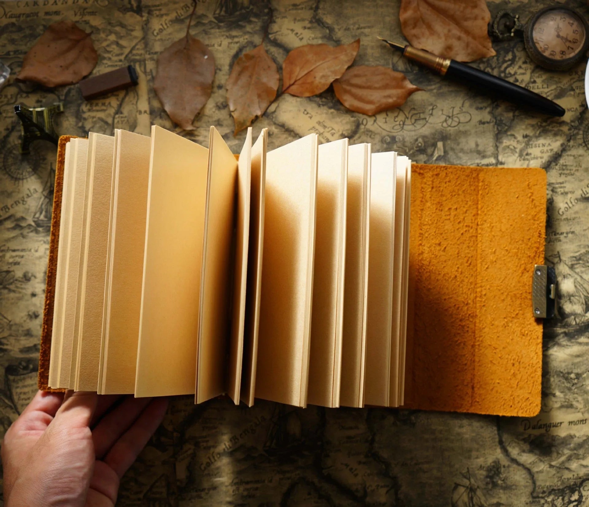Vintage cowhide leather journal open on blank brown paper pages, A5 size, Crazy Horse brown colour with distressed finish