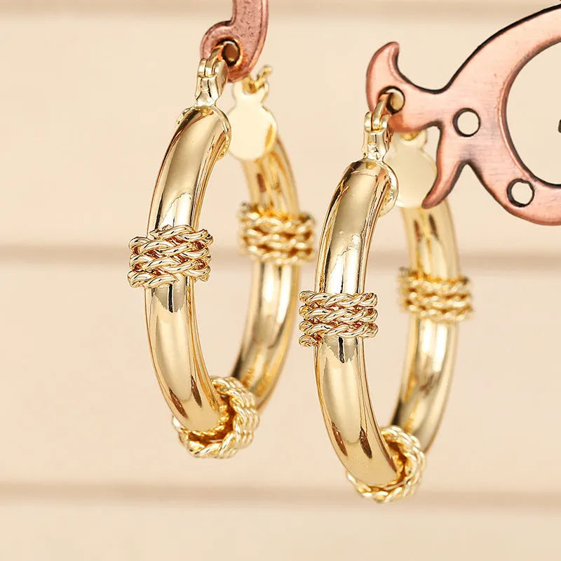 Geometric copper clip-on earrings with ring and line design elements
