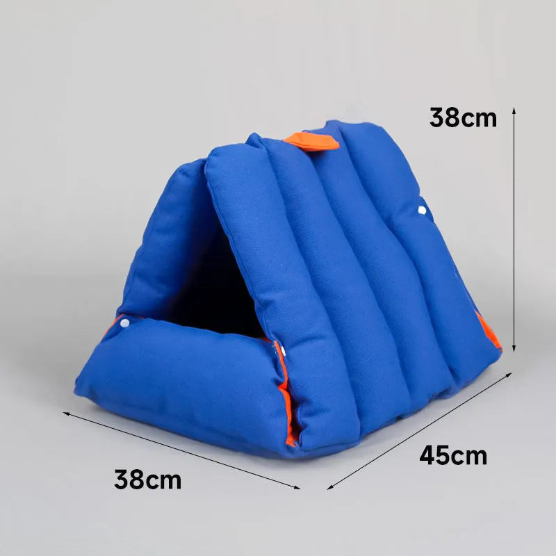 Blue triangular sofa-shaped cat nest with drilled holes for combination, showing removable cotton cover.