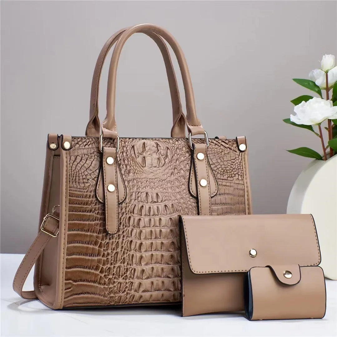 PU leather three-piece bag set showing bucket crossbody bag, wallet and card holder with contrast trim in burgundy colour
