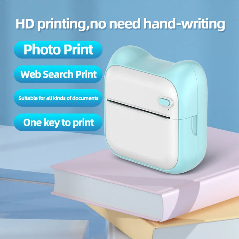 Pink mini pocket Bluetooth thermal printer on desk with USB cable, 90x45x82mm