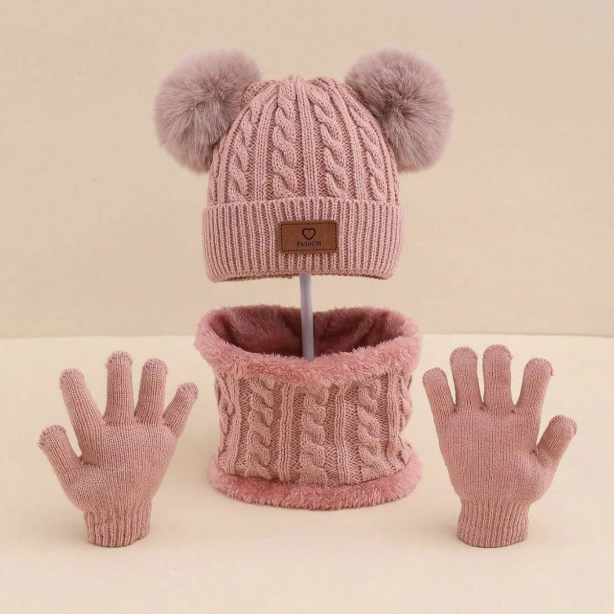 Children's three-piece acrylic knit winter set with dome crown hat and matching scarf and gloves in pink