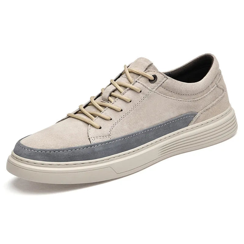 Men's grey pigskin leather casual skate shoes with flat rubber sole and lace-up front.