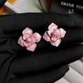 Gold plated purple oil-spot glaze flower stud earrings with fresh floral design and silver needle decoration