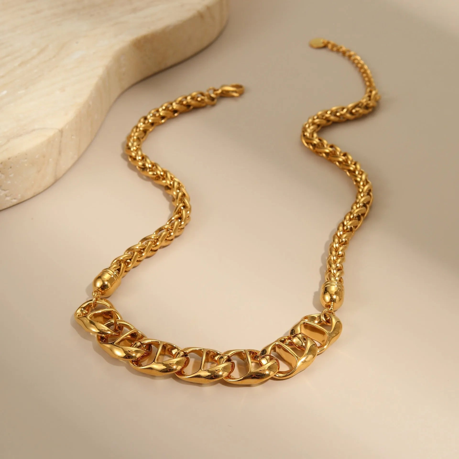 Women's gold-plated stainless steel necklace with geometric pendant design on regular chain