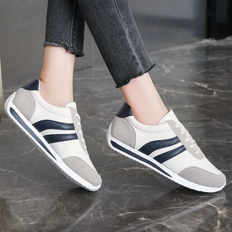 Red and blue lace-up running sneaker with soft rubber sole and PU mesh upper
