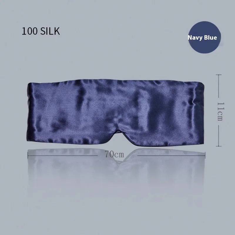 Mulberry silk sleep eye mask shown in champagne gold colour, laid flat on a surface.