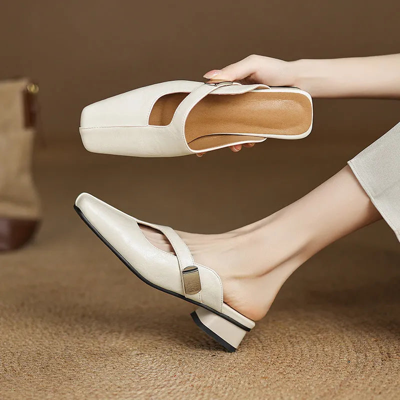 Pair of low heel outdoor slippers with a square toe in a solid colour