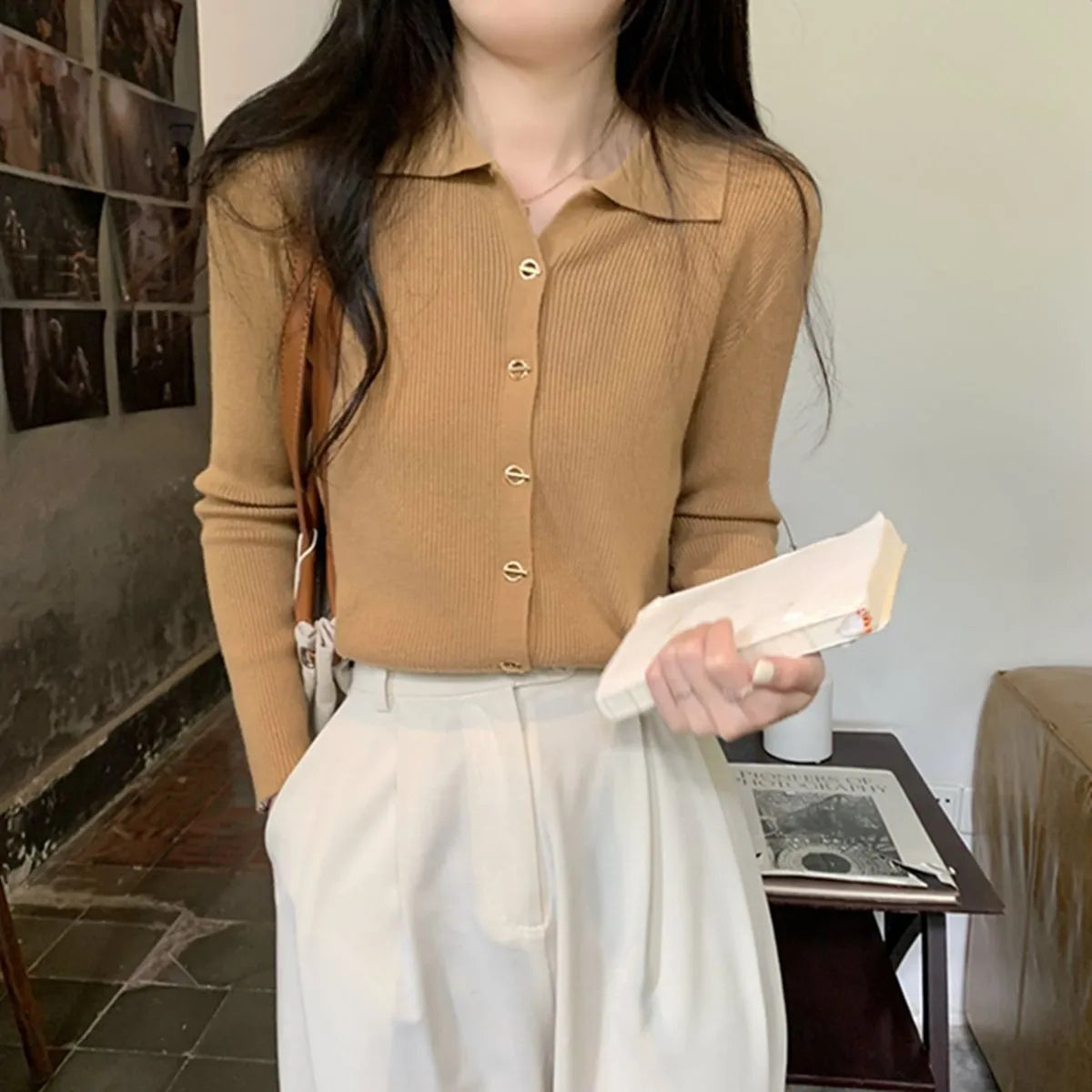 Loose fit knitted cardigan in beige, shown worn open as a long-sleeved top
