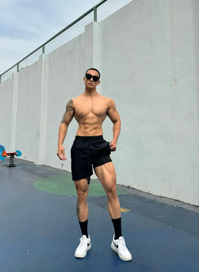 Men's black quick-drying nylon ice silk shorts with double-layer quarter-length design