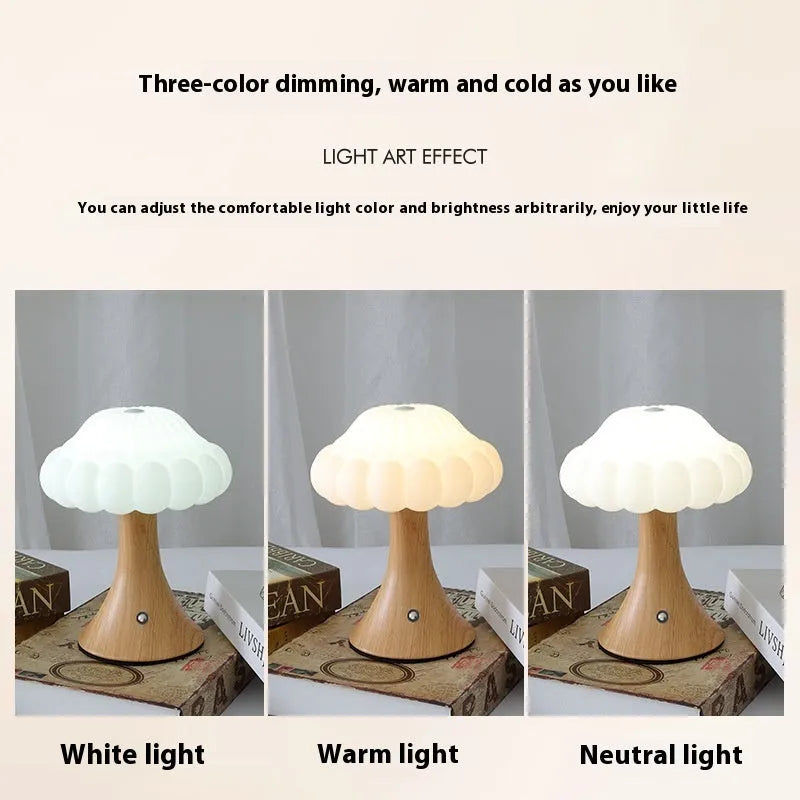 Small mushroom-shaped touch night lamp in wood grain finish on a wooden table.