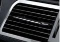 Car air-conditioning vent clip aromatherapy diffuser in black with floral scent, paddle design