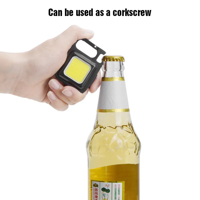 Black aluminium alloy USB rechargeable keychain torch with magnetic base and foldable handle