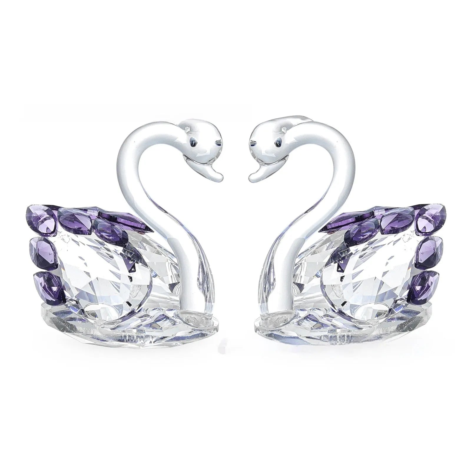 White crystal swan ornament on a desktop, shown in solid head and empty tube styles in red, blue, pink, and purple.