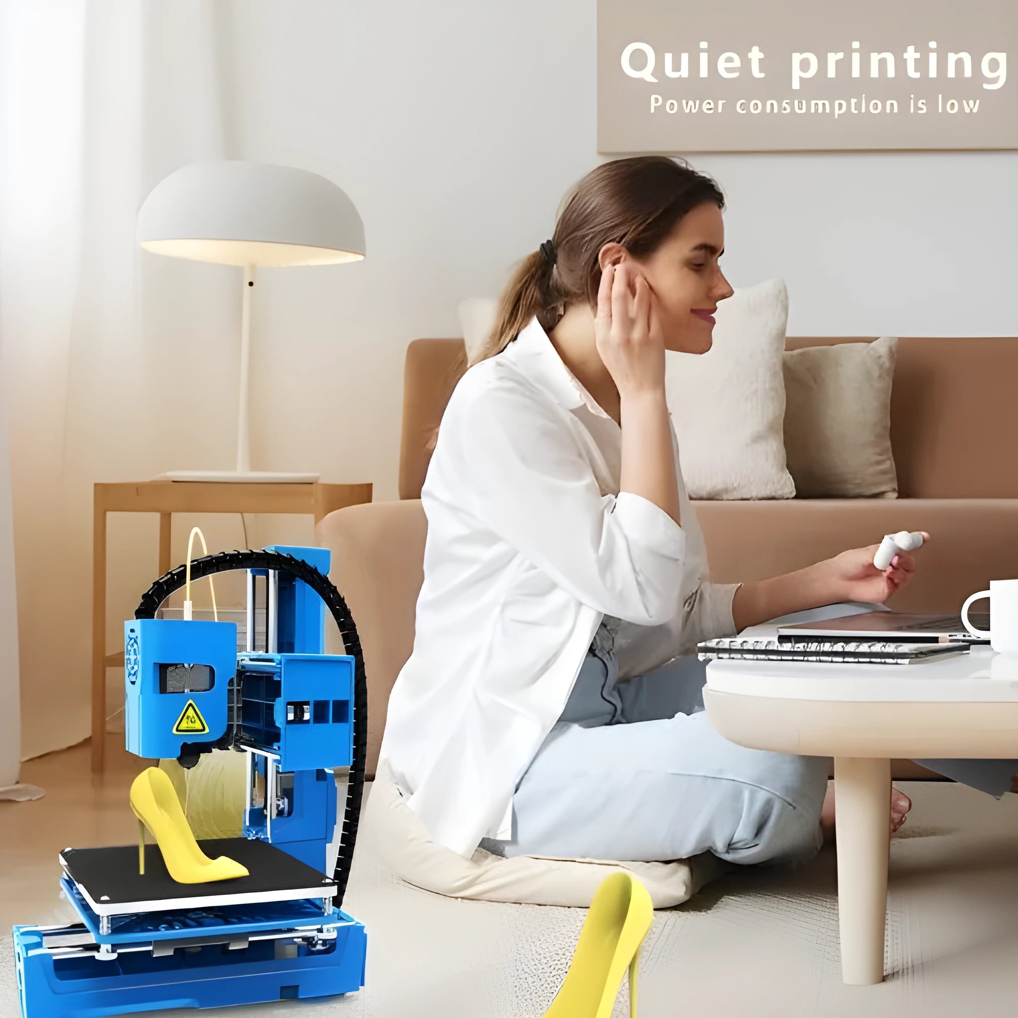 K9 New Mini desktop 3D printer on a table, showing its compact size and build plate.