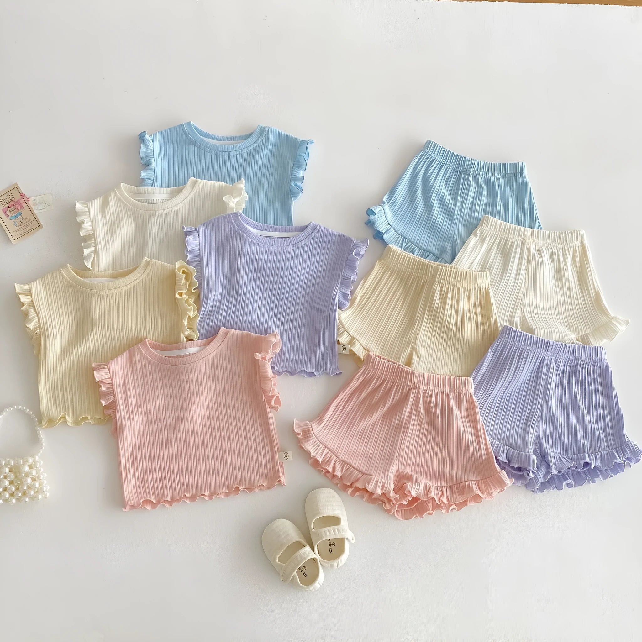 Baby girl two-piece cotton shorts set in light beige with wooden ear vest top and matching shorts