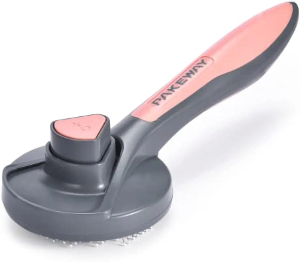 Grey self-cleaning slicker brush for grooming cats and dogs on a wooden table.