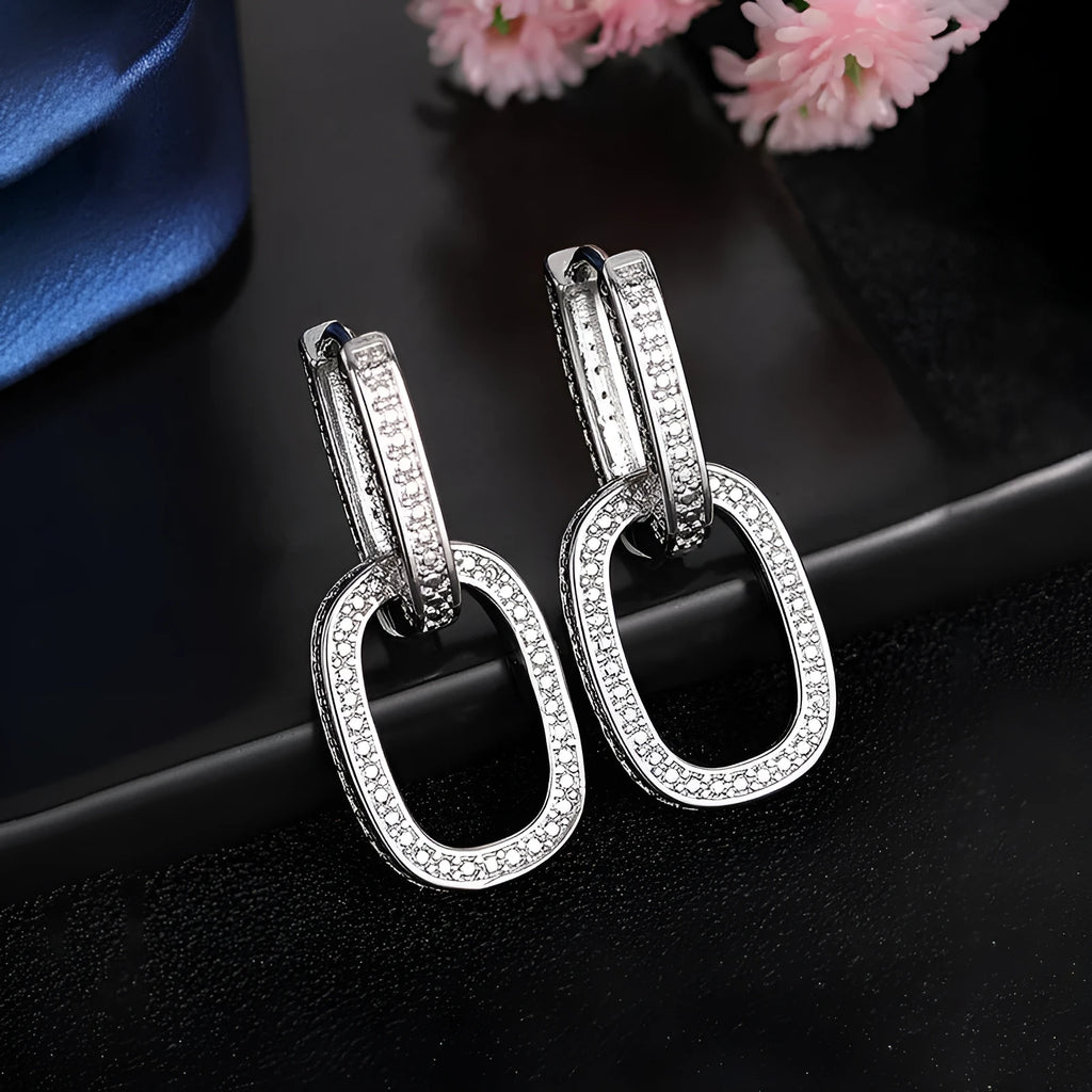 Pair of copper earrings with inlaid zircon, U-shaped geometric buckle design in white gold colour