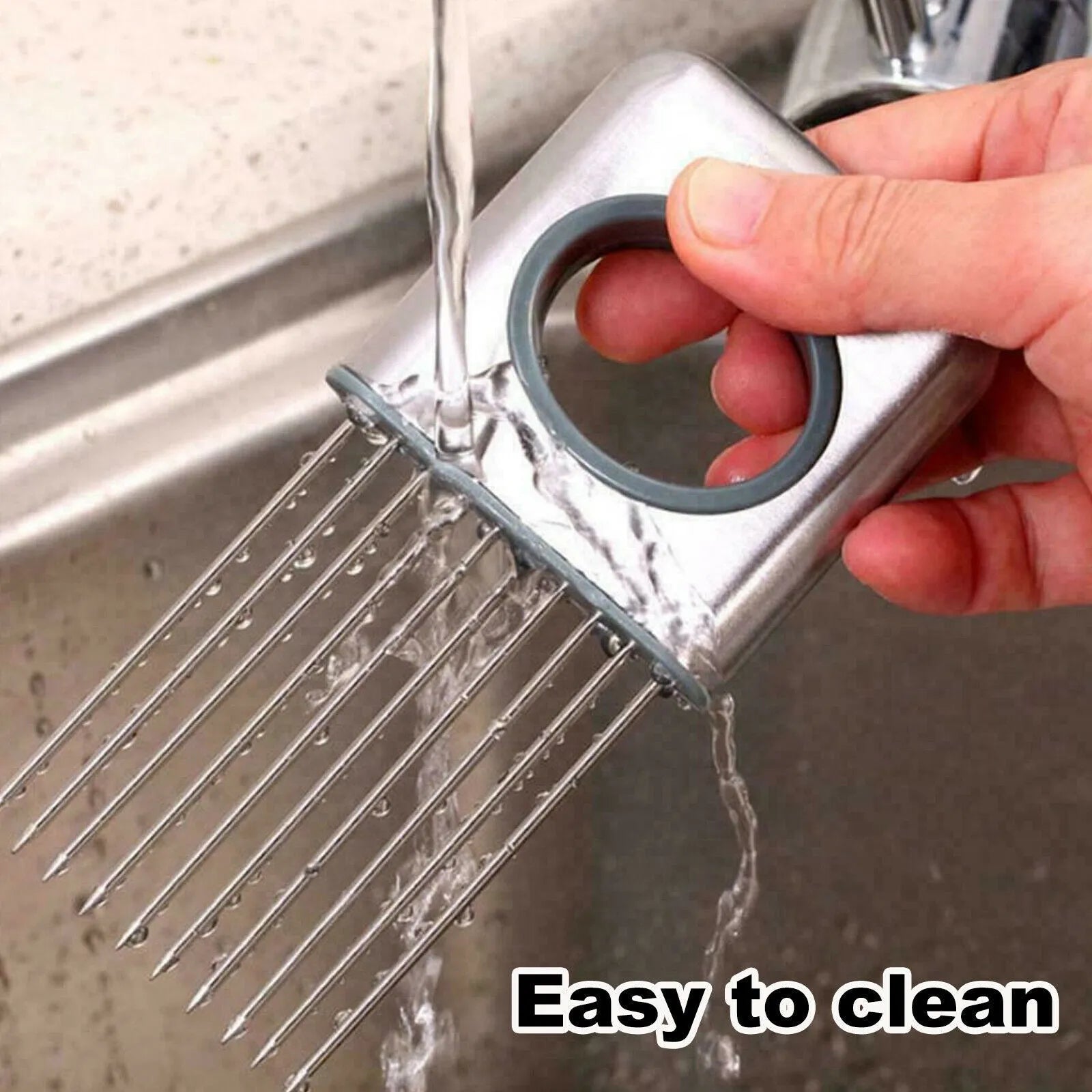 Stainless steel onion holder with ultra-sharp prongs and finger guard protector on a kitchen counter