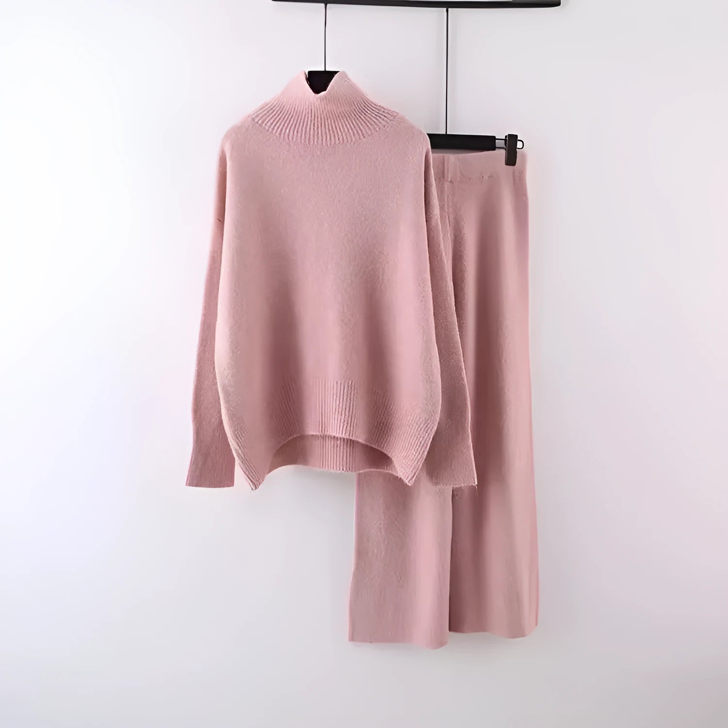 Women's casual two-piece set showing sweater and wide leg trousers in solid colour with thread detail