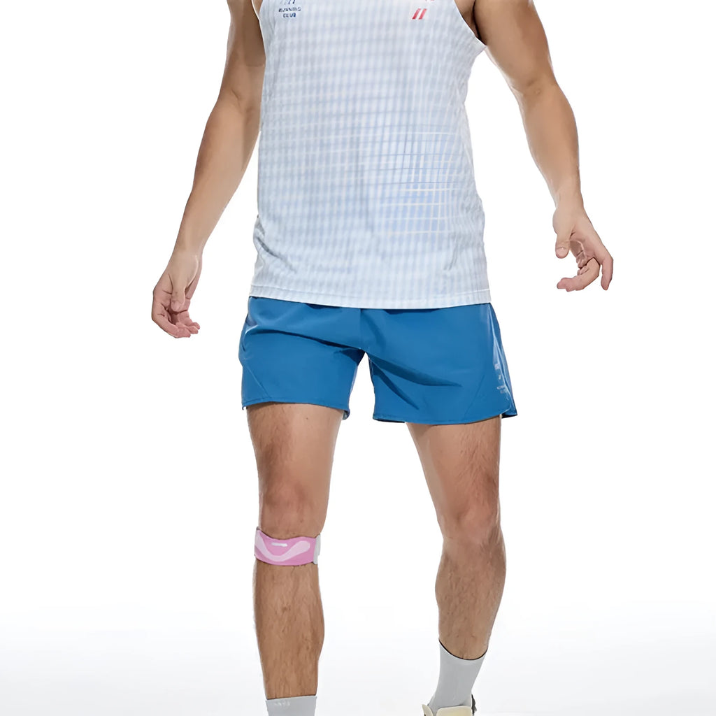 Men's black running shorts with laser stitching on a grey background, showing stretch fabric.