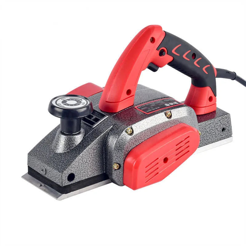 Red desktop electric wood planer with aluminium shell showing 82mm cutting width