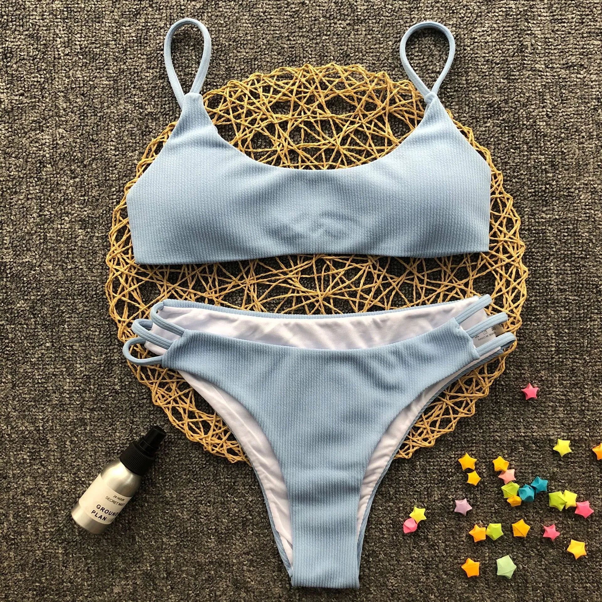 Blue striped bikini set with polyester and nylon fabric, two-piece swimwear on display
