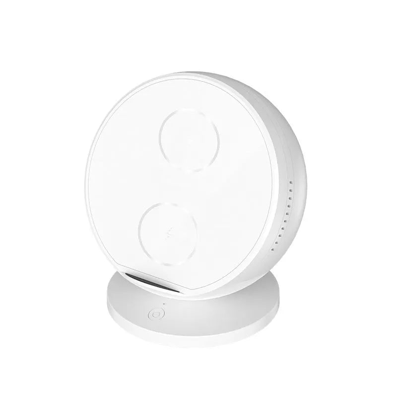 Black multifunctional mobile phone wireless charger holder with Bluetooth speaker, showing phone in cradle.