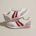 Red and blue lace-up running sneaker with soft rubber sole and PU mesh upper