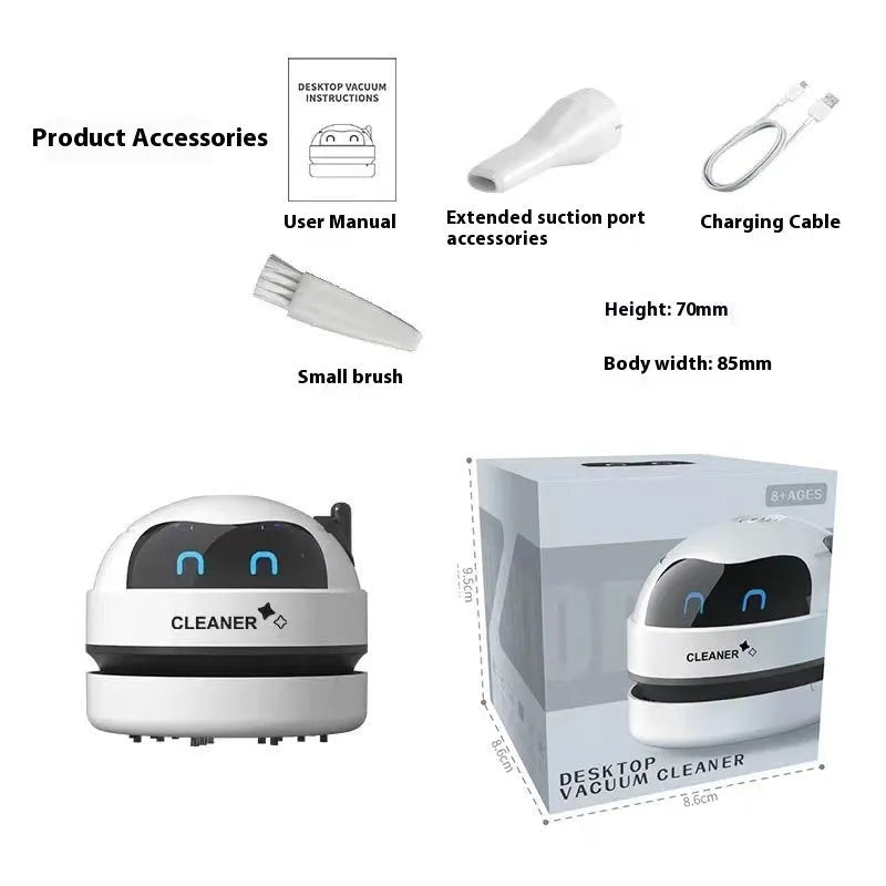 Handheld desktop vacuum cleaner in blue rocket design with USB charging cable on a wooden desk.