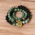 Green and black elastic beaded fashion bracelet with alloy clasp showing adjustable design