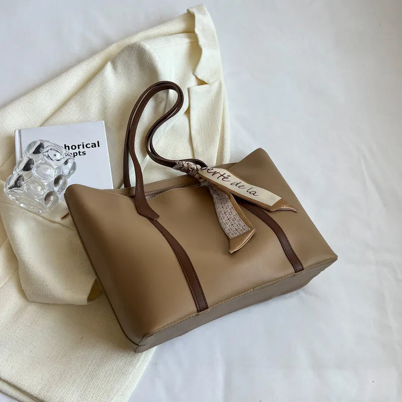 Canvas bucket tote bag with crossbody strap showing sandwich pocket organisation and soft construction