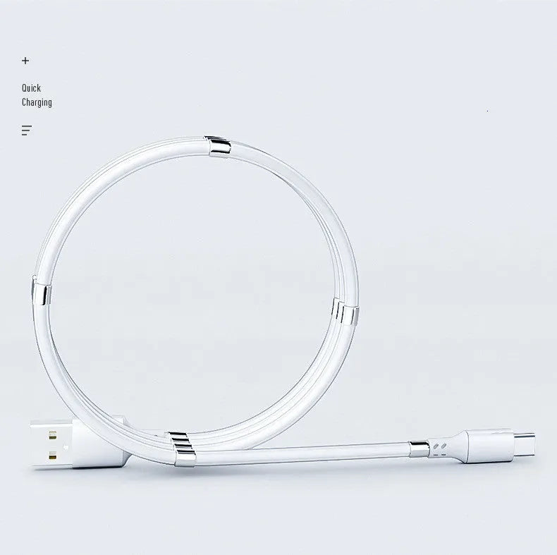 White magnetic nano data line with aluminium alloy joints and multiple connector heads on a desk