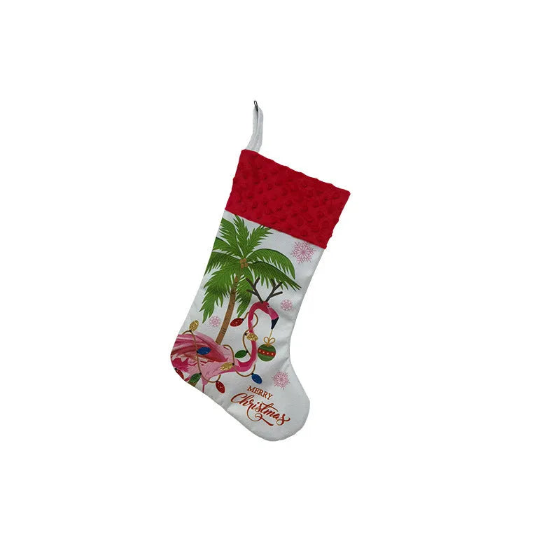Red cloth flamingo Christmas stocking decoration with white trim, shown hanging.
