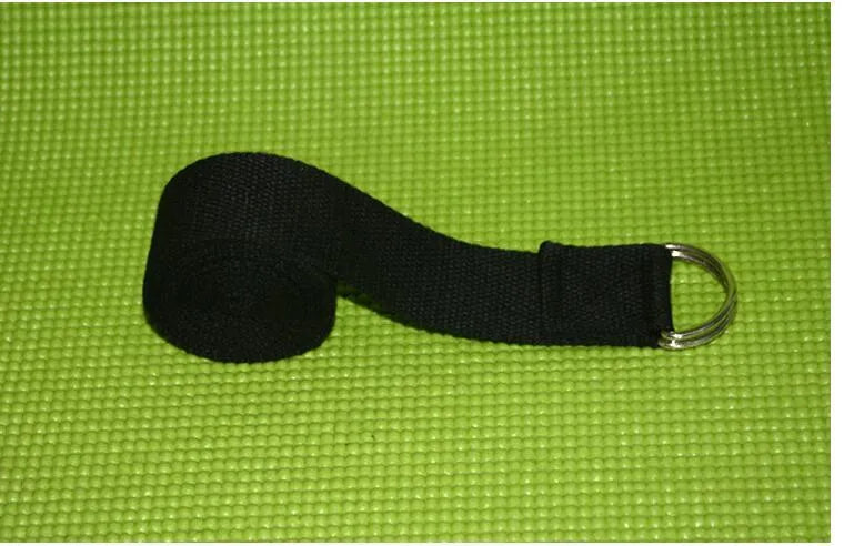 Pure colour EVA yoga brick, thick non-slip mat, and cotton tension band on a floor, in blue, purple, pink, red, black, gray