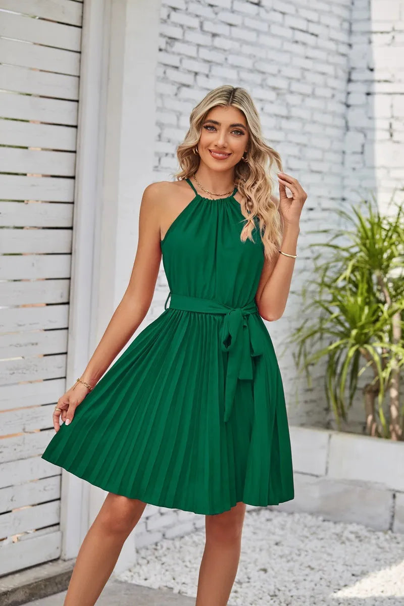 Women's black halter neck strapless sundress with a pleated midi skirt and an adjustable waist belt.