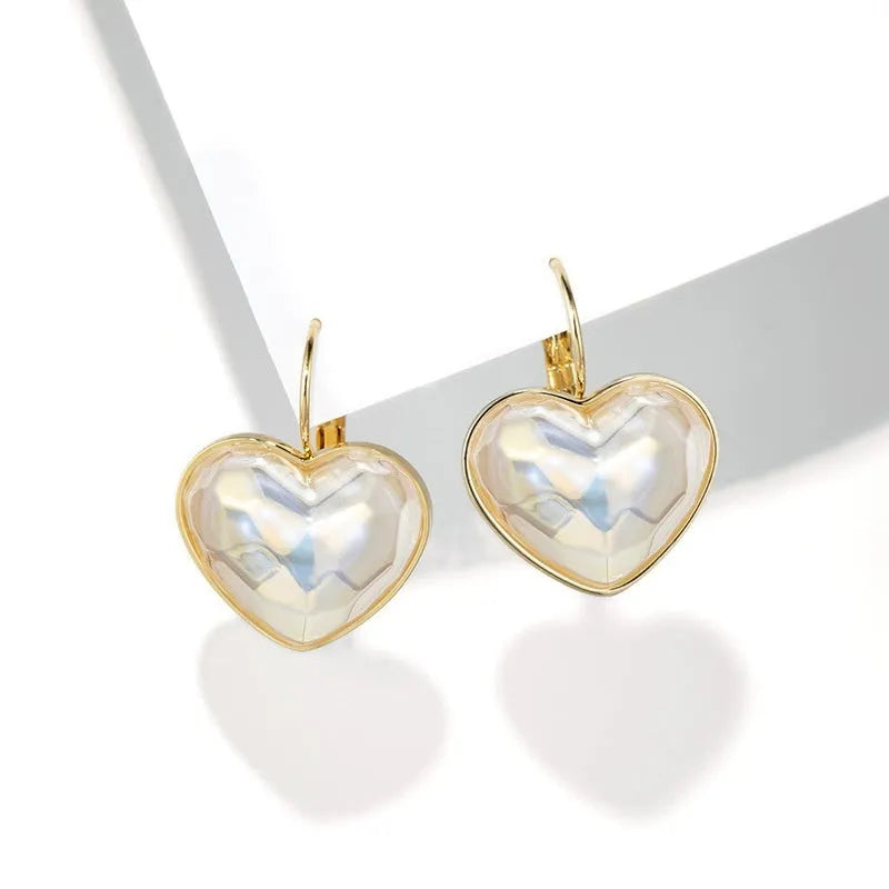 Gold coloured alloy women's ear clip with natural style and metal decorative elements.