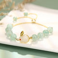 Green aventurine and strawberry quartz rabbit charm bracelet for women with copper and gold details