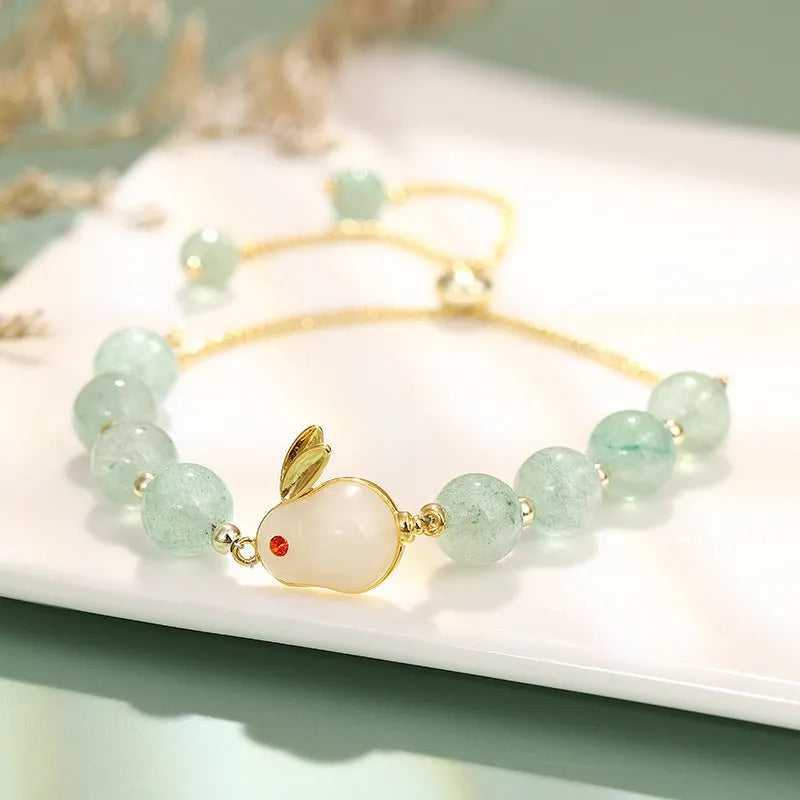 Green aventurine and strawberry quartz rabbit charm bracelet for women with copper and gold details