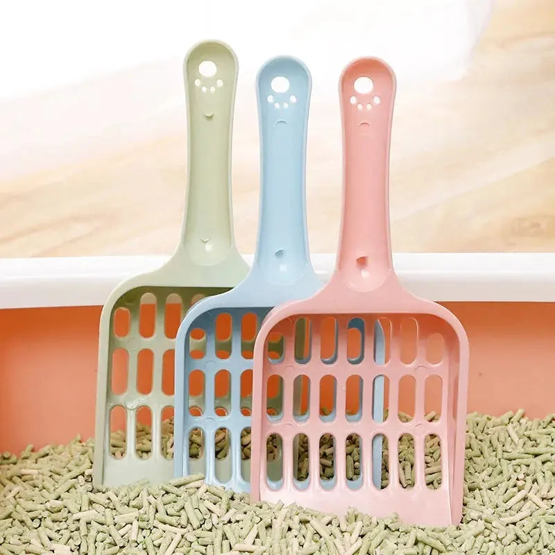 Plastic cat litter scoop in blue, green or pink colours, measuring 20cm long